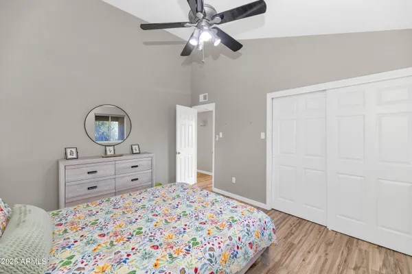 a bedroom with a bed and a dresser