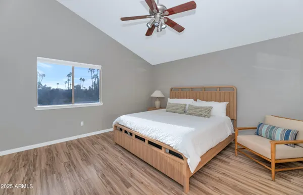 a bedroom with a bed and window