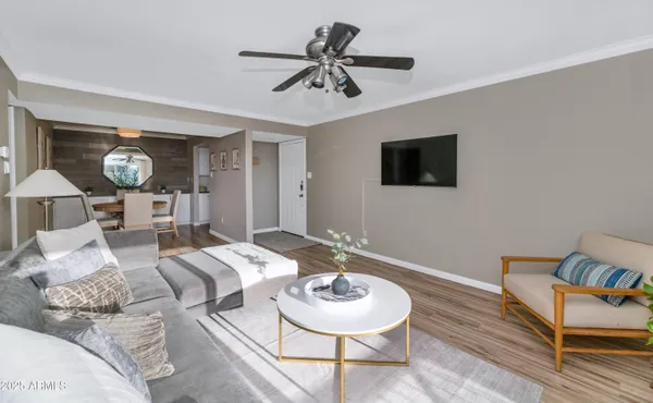 a living room with furniture and a flat screen tv