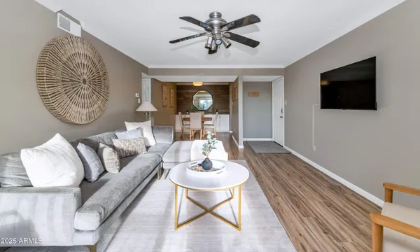 a living room with furniture and a flat screen tv