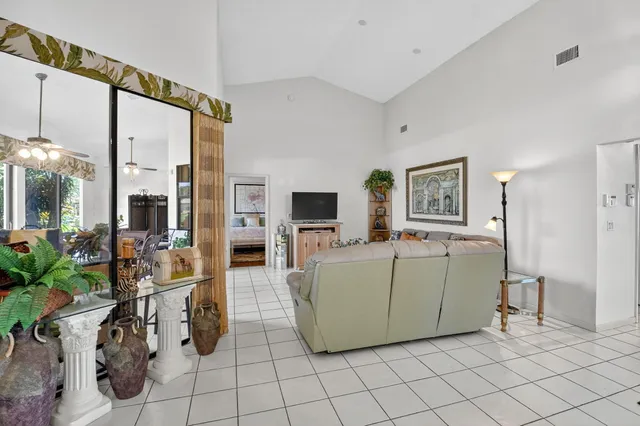 a kitchen with granite countertop a stove top oven microwave and cabinets