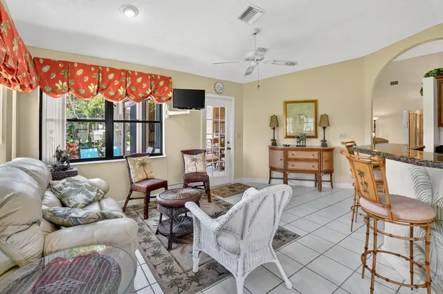 a kitchen with stainless steel appliances granite countertop a refrigerator a stove and a sink