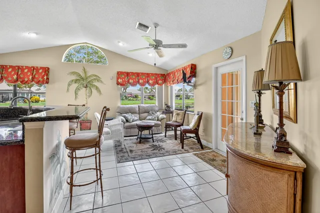 a view of a dining room with furniture wooden floor and chandelier