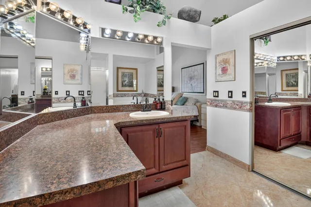 a bedroom with furniture and flat screen tv