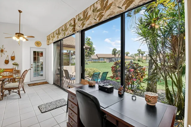 a view of a chairs and table in a backyard