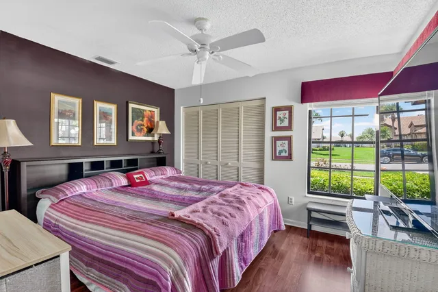 an aerial view of a house with a garden and lake view