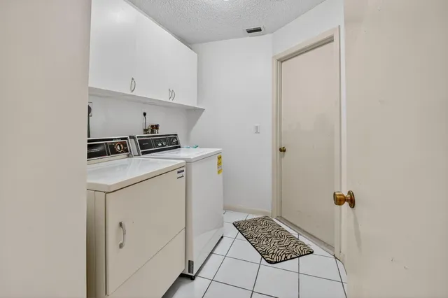 a front view of a house with a yard table and chairs