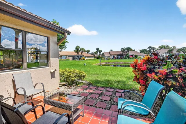 an aerial view of a house with a lake view