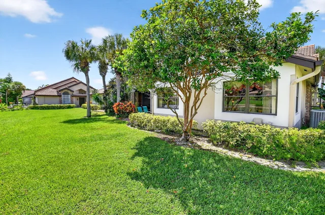 an aerial view of a house with a lake view