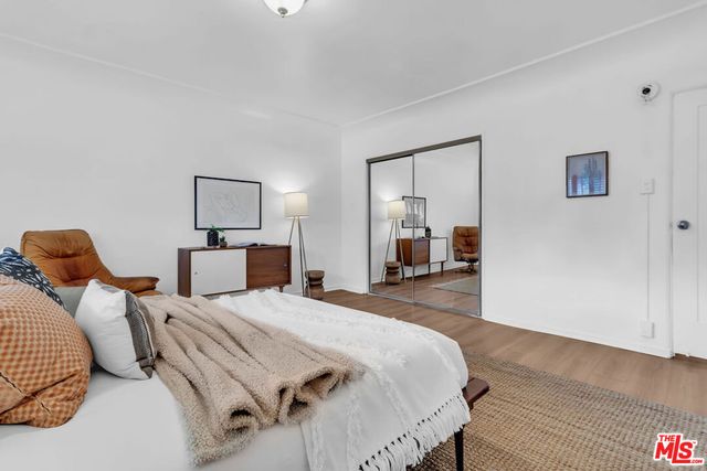 a bedroom with a bed and a lamp