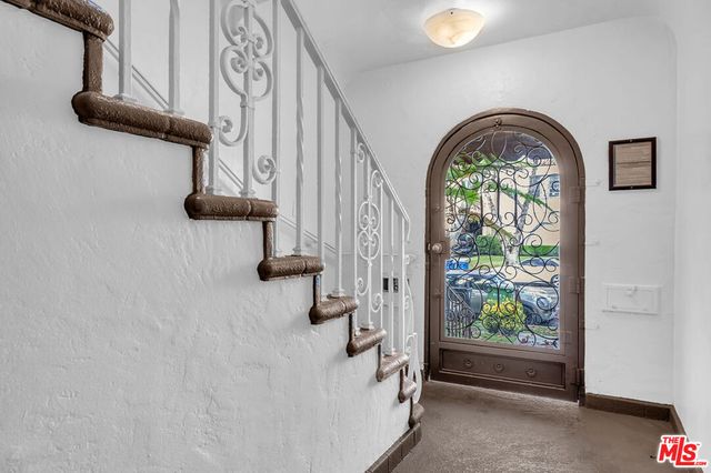 a view of entryway with a front door