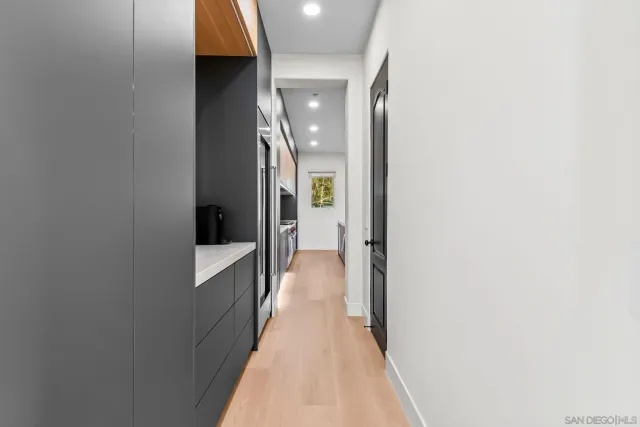 a view of a hallway with a white walls