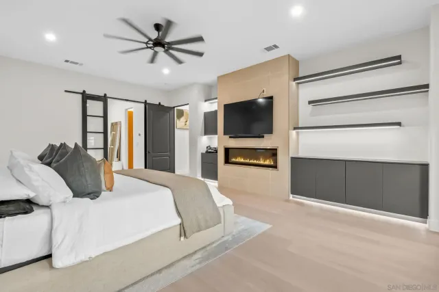 a spacious bedroom with a large bed and a window