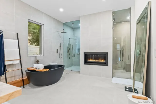 a bathroom with a shower toilet and sink