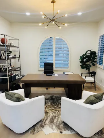 a en suite bathroom with a sink and a large mirror