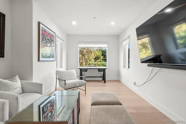 a spacious bathroom with a double vanity sink a mirror and a bathtub