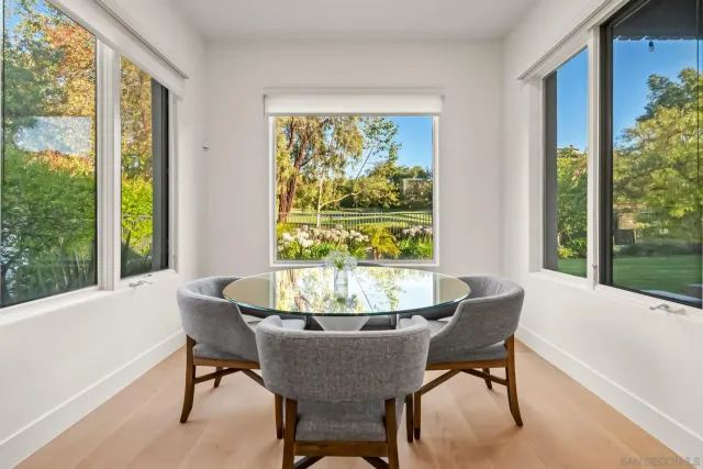 a view of a dining room with furniture window and outside view