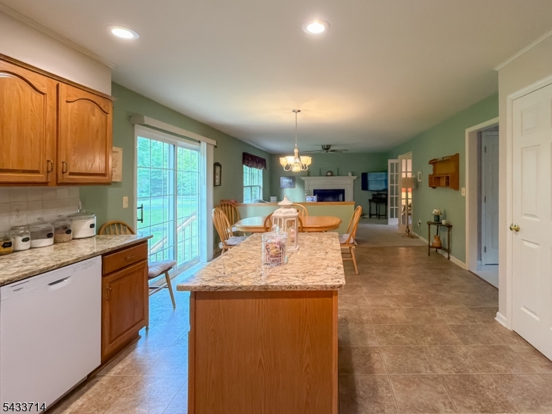 29 Lark Lane Oak Ridge, NJ 07438 - Photo 8 of 26 a kitchen with stainless steel appliances granite countertop a sink stove and refrigerator