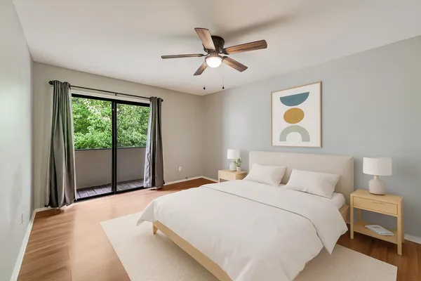 a bedroom with a large bed and a window