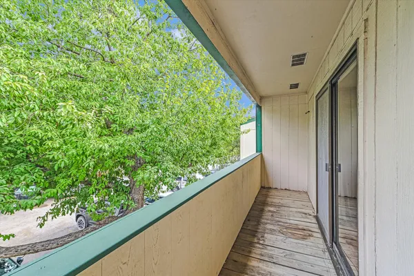 a backyard of a house with table and chairs