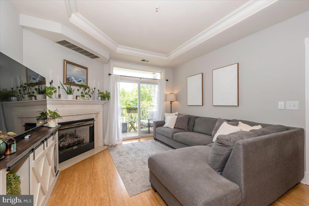 2500 Waterside Drive, Unit 110 Frederick, MD 21701 - Photo 14 of 106 a living room with furniture and a fireplace