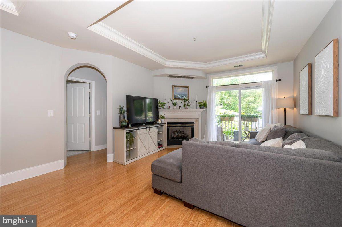 2500 Waterside Drive, Unit 110 Frederick, MD 21701 - Photo 16 of 106 a living room with furniture and a flat screen tv
