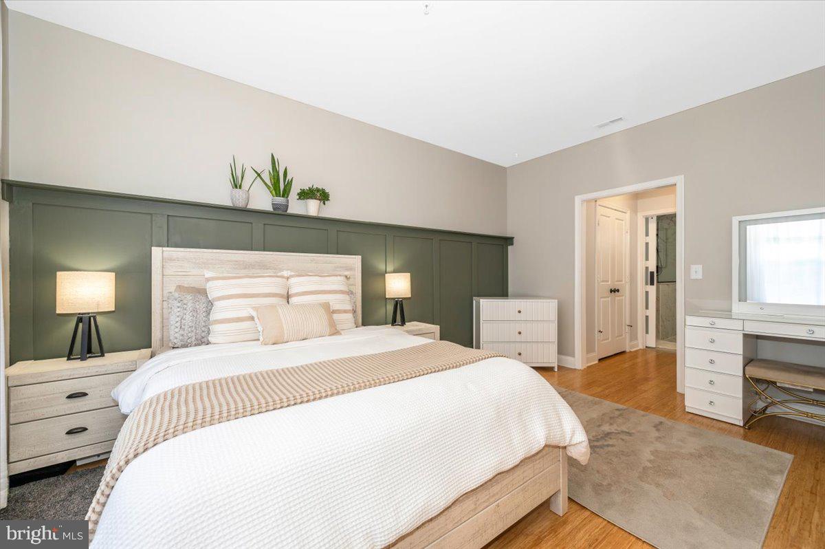 2500 Waterside Drive, Unit 110 Frederick, MD 21701 - Photo 34 of 106 a bedroom with a bed and a dresser