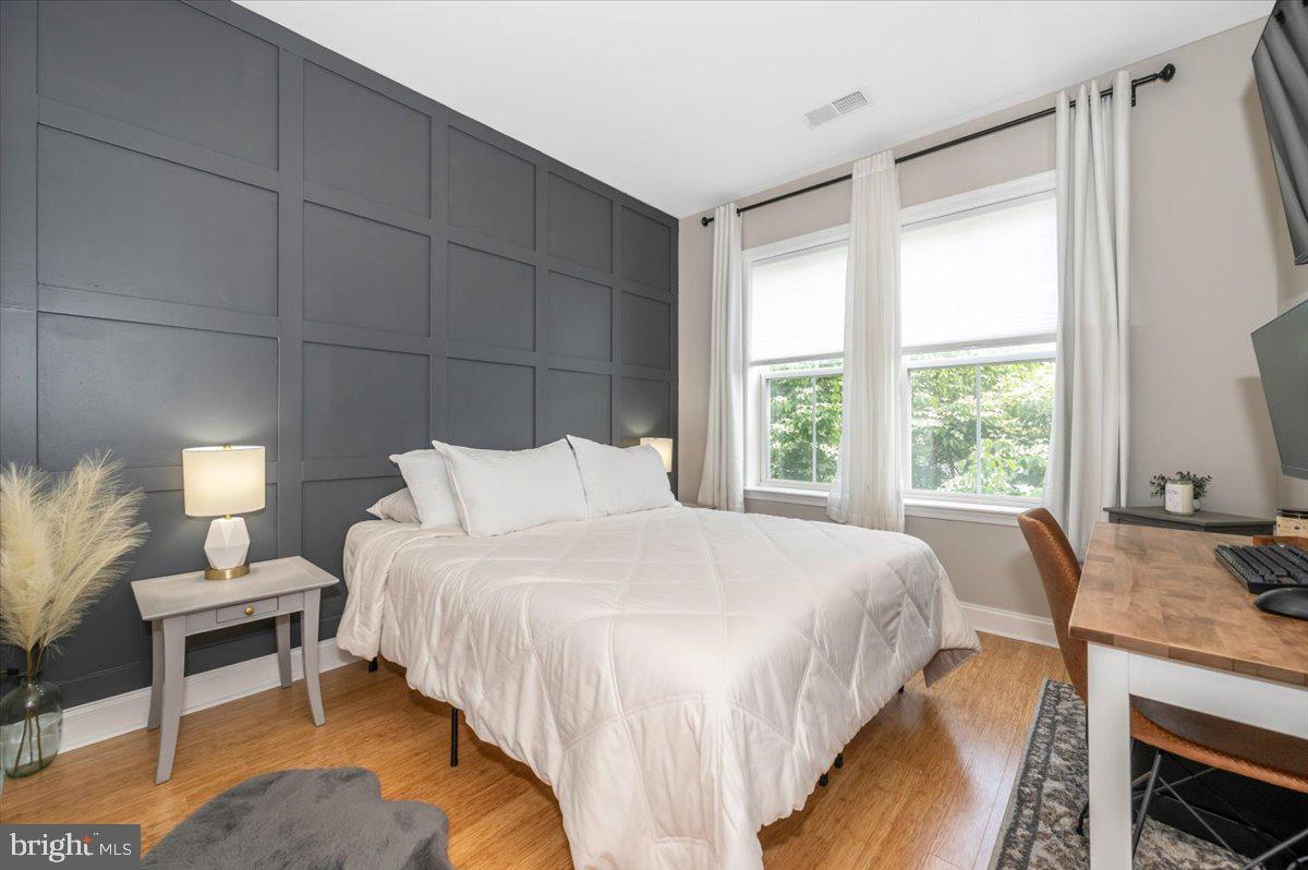 2500 Waterside Drive, Unit 110 Frederick, MD 21701 - Photo 42 of 106 a bedroom with a bed and a window