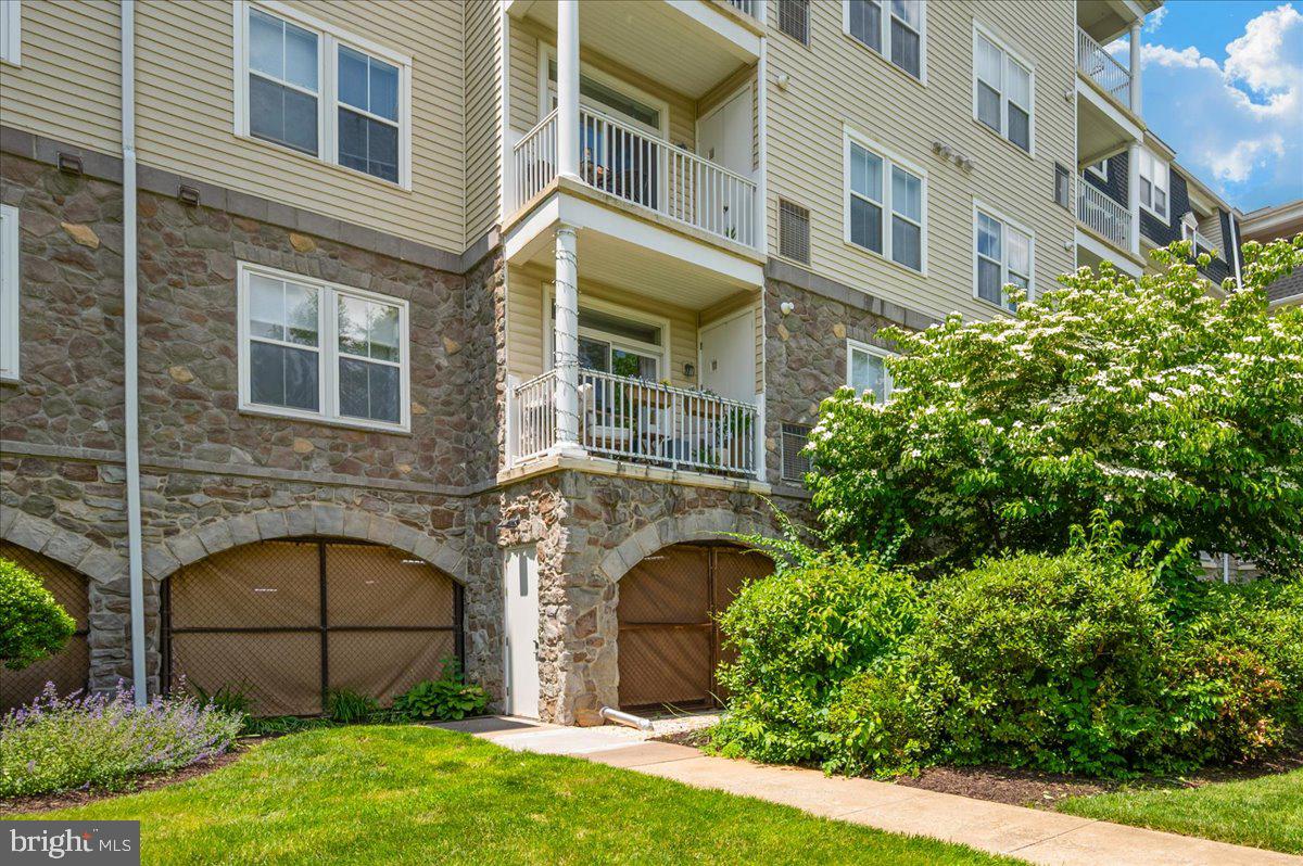 2500 Waterside Drive, Unit 110 Frederick, MD 21701 - Photo 49 of 106 a view of a brick building next to a yard