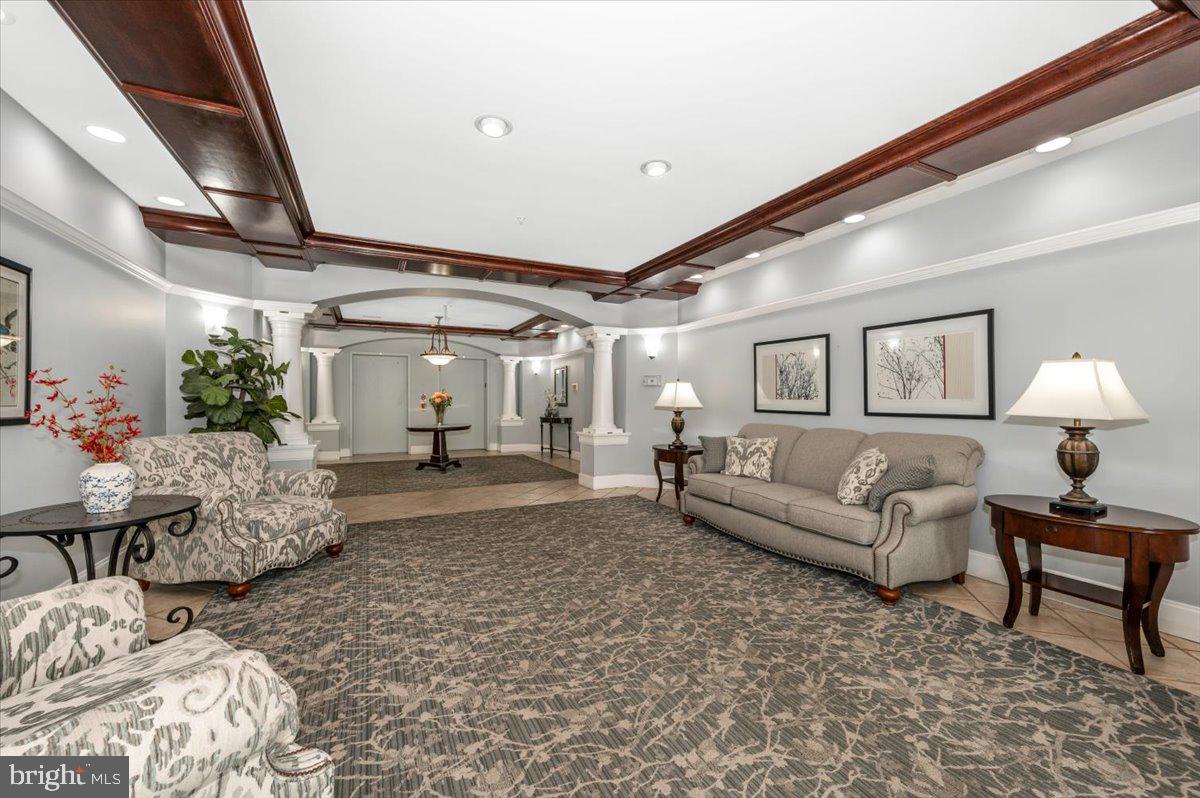 2500 Waterside Drive, Unit 110 Frederick, MD 21701 - Photo 6 of 106 a living room with furniture and a chandelier