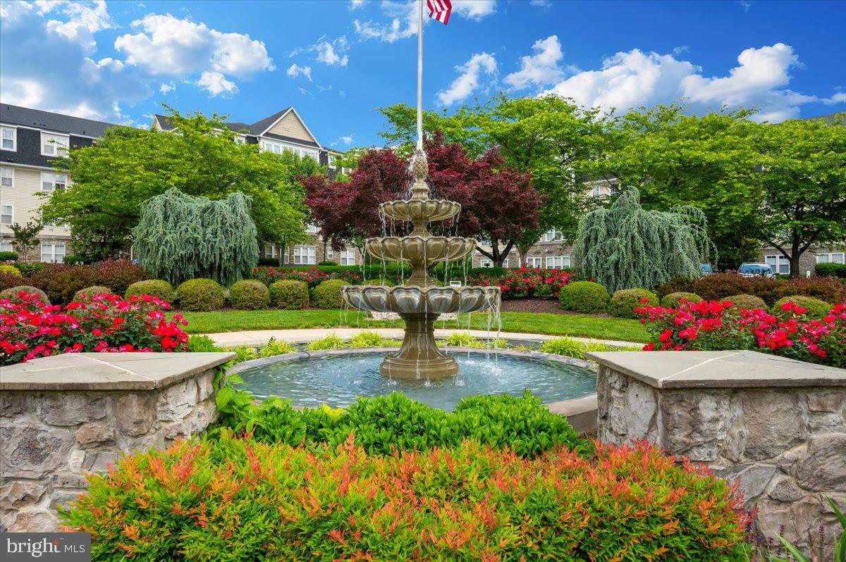 2500 Waterside Drive, Unit 110 Frederick, MD 21701 - Photo 65 of 106 a view of a fountain in front of a house with a fountain