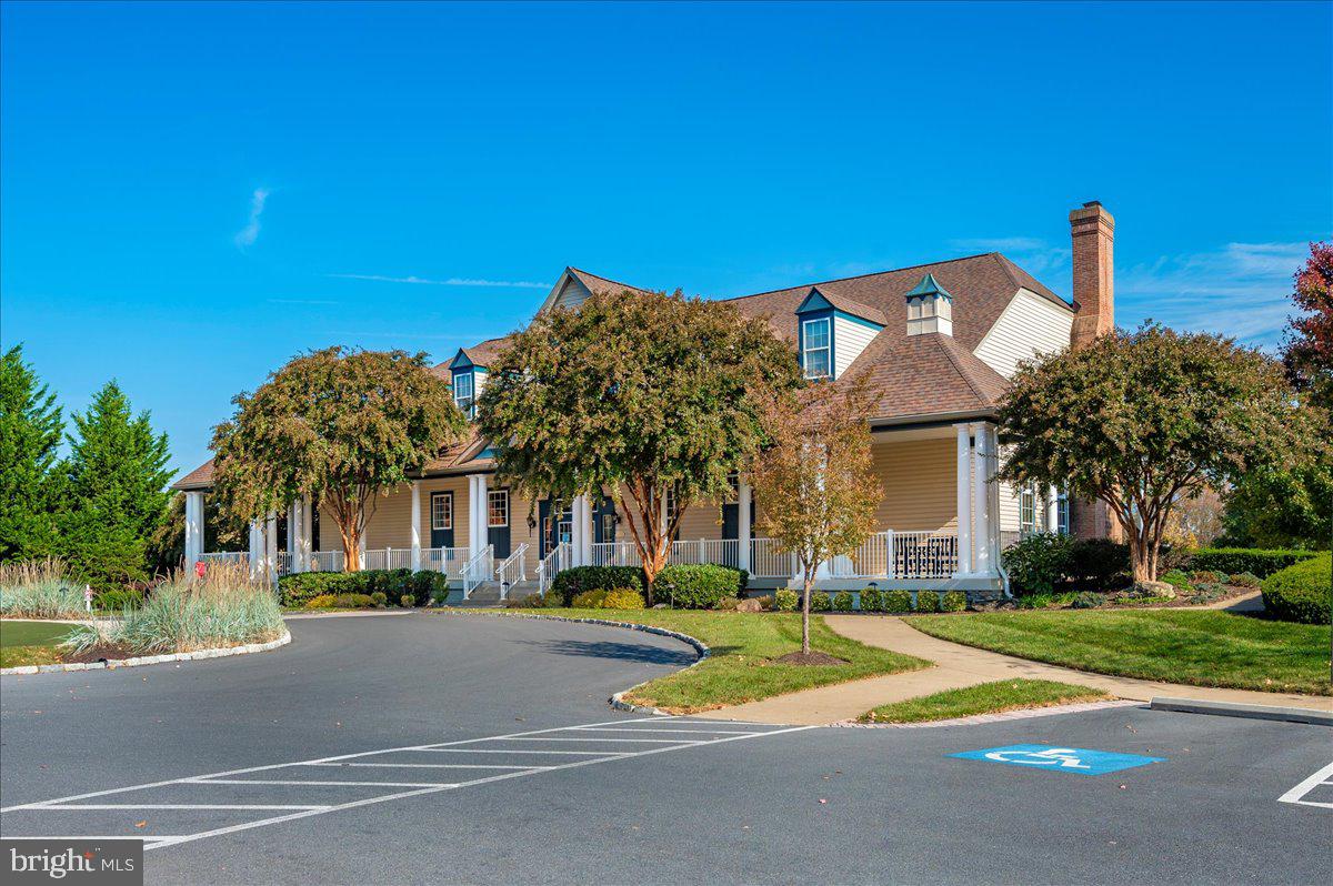 2500 Waterside Drive, Unit 110 Frederick, MD 21701 - Photo 80 of 106 a front view of a house with a yard and palm trees