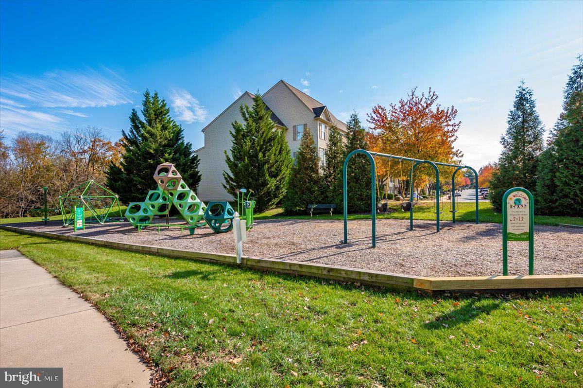2500 Waterside Drive, Unit 110 Frederick, MD 21701 - Photo 83 of 106 a front view of a house with a yard