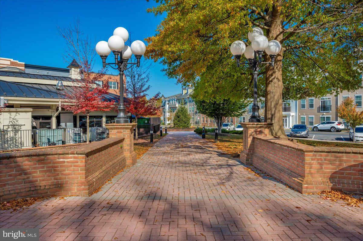 2500 Waterside Drive, Unit 110 Frederick, MD 21701 - Photo 90 of 106 a view of a house with swimming pool and sitting area