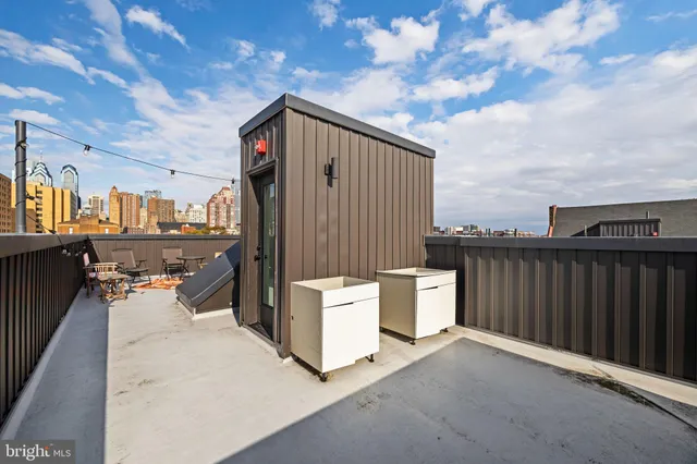a view of a balcony with furniture
