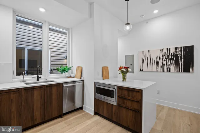 a kitchen with a sink and cabinets