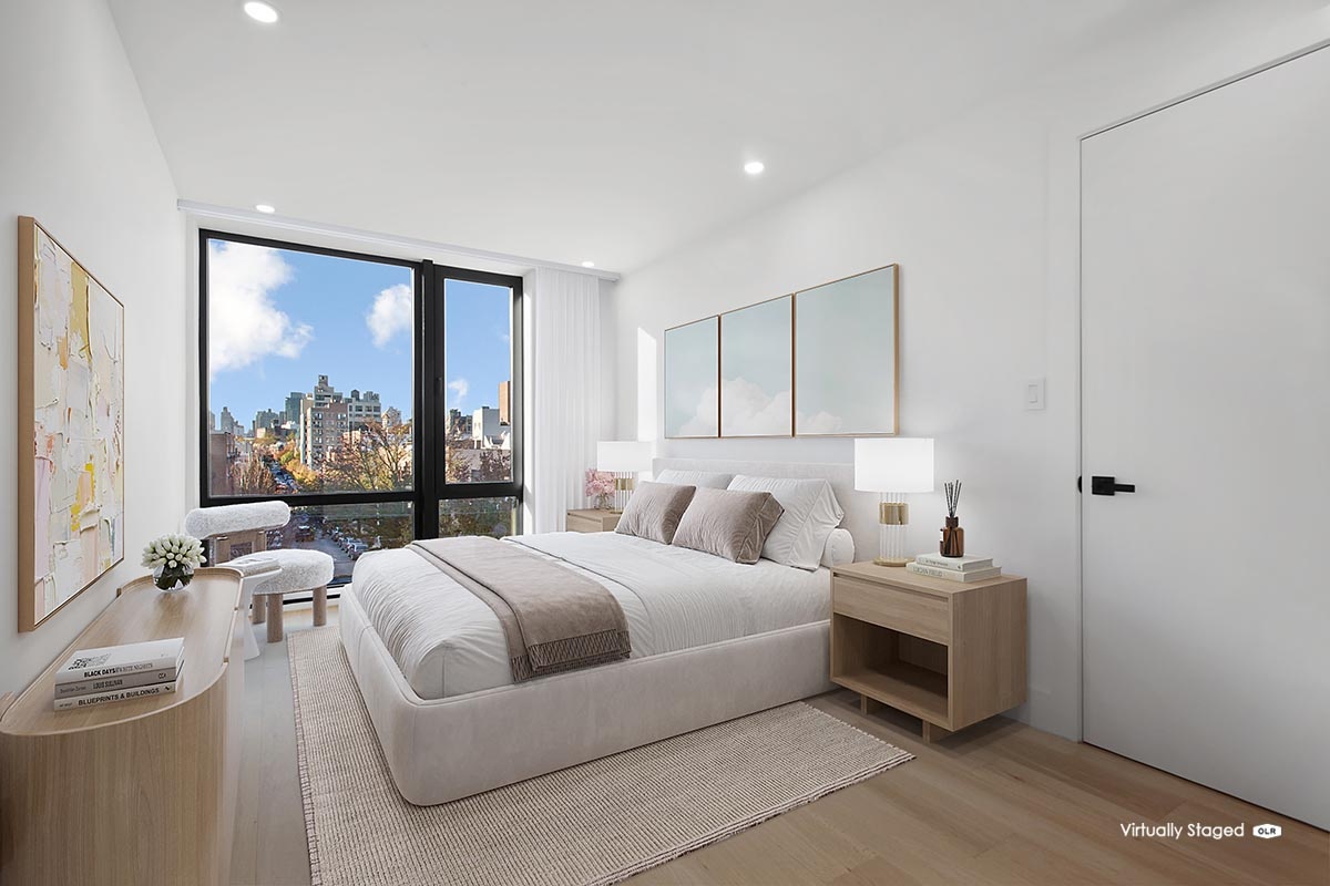 27-23 Crescent Street, Unit 4A Queens, NY 11102 - Photo 2 of 7 a bedroom with a bed and large windows