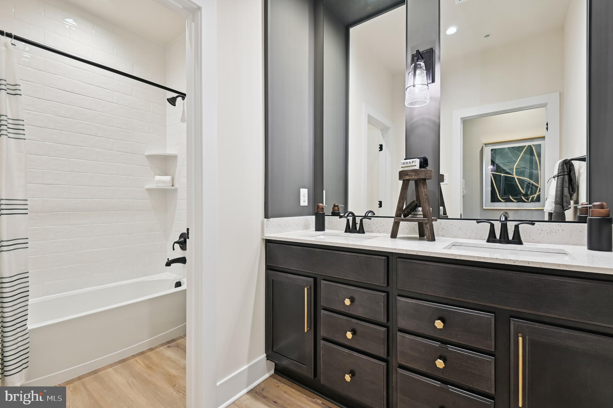 13812 Pecan Ridge Way Bowie, MD 20715 - Photo 22 of 44 a bathroom with a double vanity sink mirror and bathtub