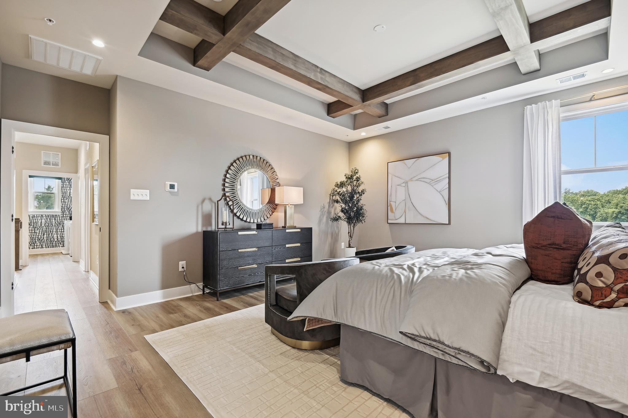 13812 Pecan Ridge Way Bowie, MD 20715 - Photo 35 of 44 a bedroom with a bed a mirror on dresser and a table