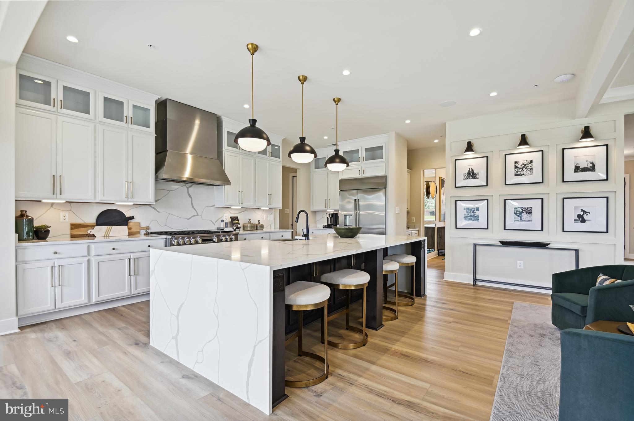 13812 Pecan Ridge Way Bowie, MD 20715 - Photo 9 of 44 a kitchen with stainless steel appliances granite countertop a sink cabinets and wooden floor