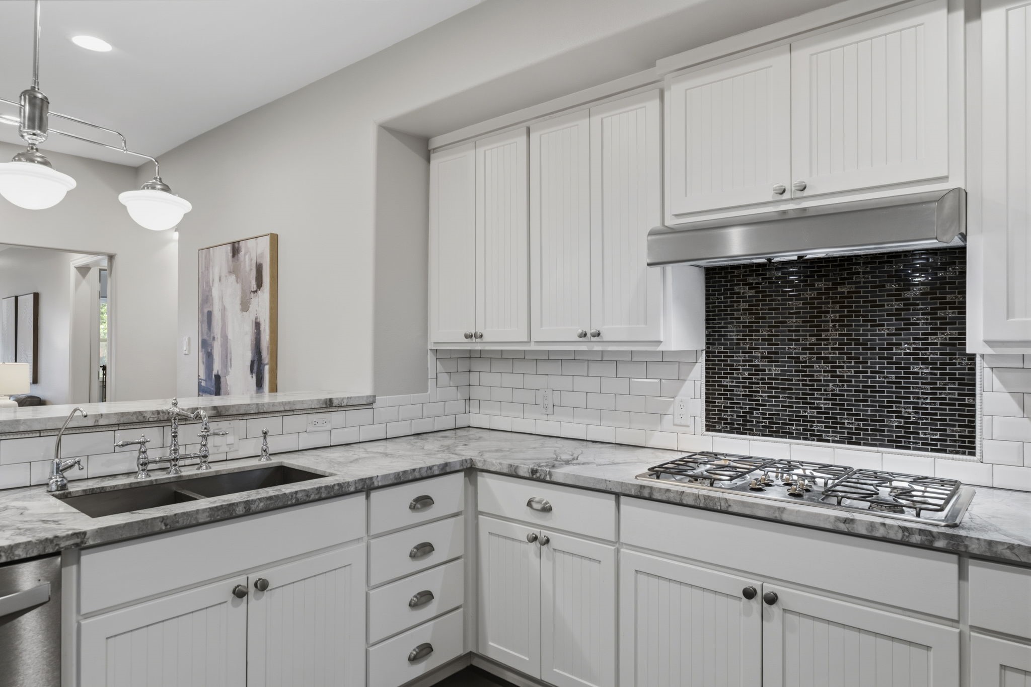 4733 Carleen Road Houston, TX 77092 - Photo 9 of 22 A mix of updated finishes and functional storage makes this kitchen as practical as it is beautiful.