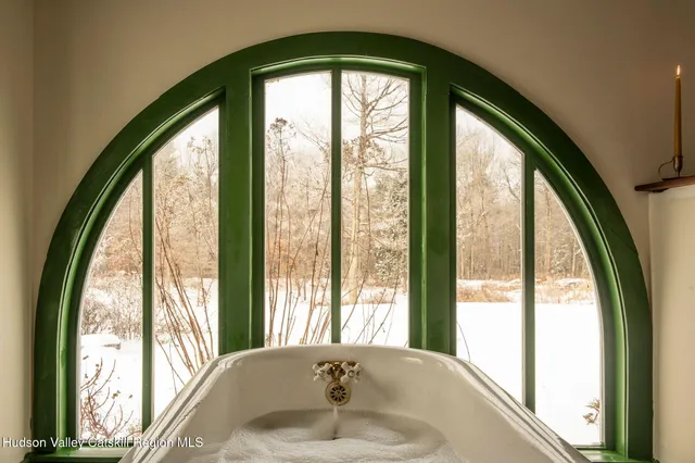 a bathroom with a large window and a large window