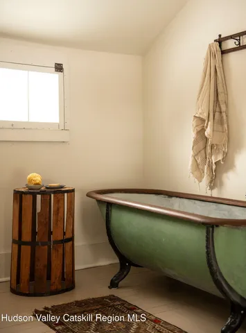 a view of front door with a mirror