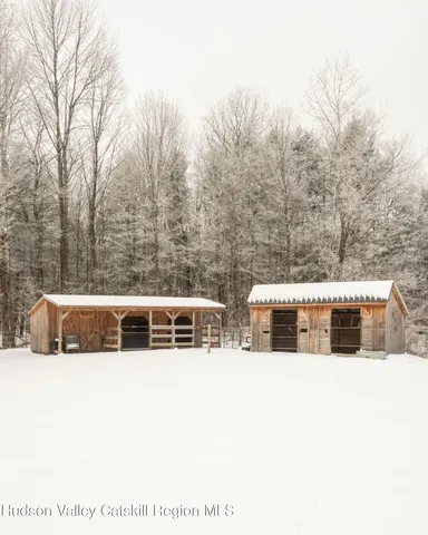 a front view of a house with outdoor seating