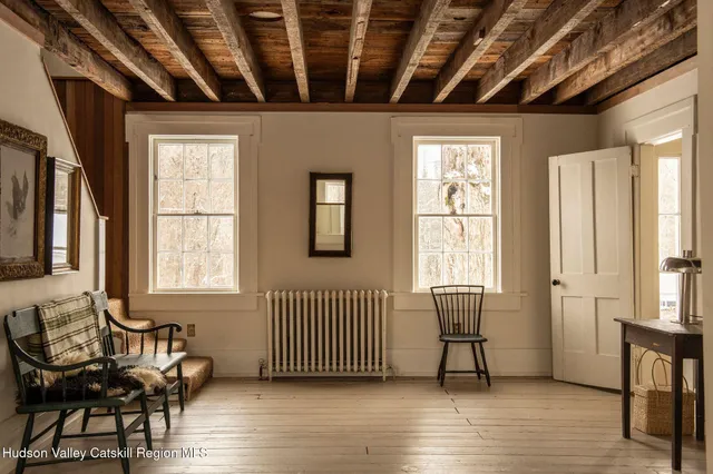 a view of a livingroom with furniture and a window