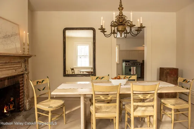 a dining room with furniture and chandelier