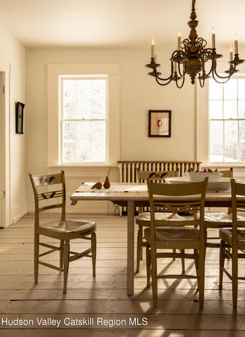 a kitchen with a table and chairs in it