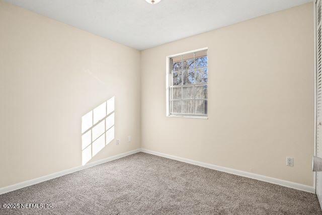 1130 Crown Drive Jacksonville, FL 32221 - Photo 20 of 27 an empty room with windows