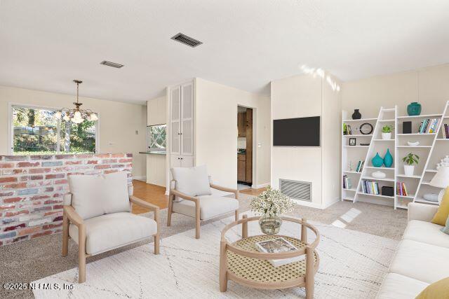 1130 Crown Drive Jacksonville, FL 32221 - Photo 2 of 27 a living room with furniture a flat screen tv and kitchen view