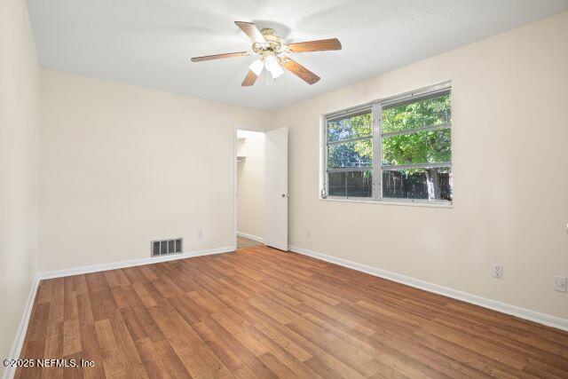 1130 Crown Drive Jacksonville, FL 32221 - Photo 22 of 27 a view of empty room with wooden floor and fan